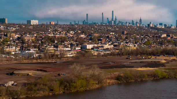 istock Massive construction at the river shore destroyed the park, creating environmental issues and ecological problems. Overpeck County Park, Leonia, New Jersey. Panoramic view of Manhattan at the distance. 1430174840