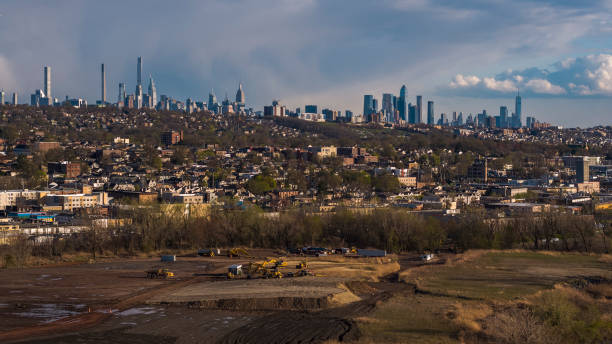 istock Construction site in Overpeck County Park, Leonia, New Jersey in the early spring. Distant view of Manhattan and Jersey City with cloudy sky, before rain. 1430174845