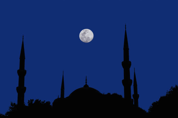 istock silhouette islamic mosque at night with moon on blue sky 1430188211