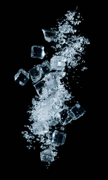 istock Ice cubes into the water with a bubble on black background 1430192782