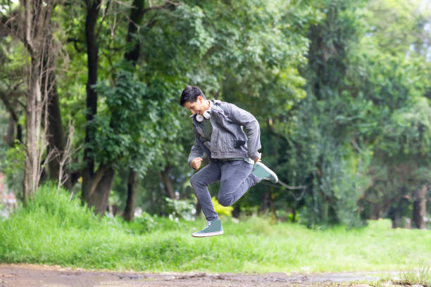 Young Latino man jumping up and down with excitement