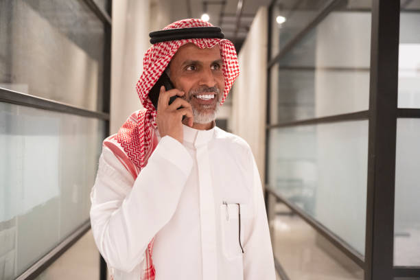 istock Riyadh businessman smiling during call on smart phone 1430206707