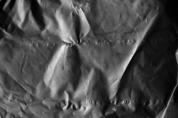transparent plastic bag film wrap overlay texture on black background