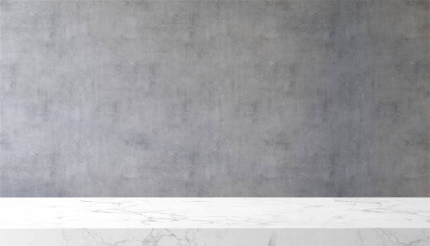 White marble tabletop or countertop in loft, modern and minimal concrete wall room with sunlight from window at home