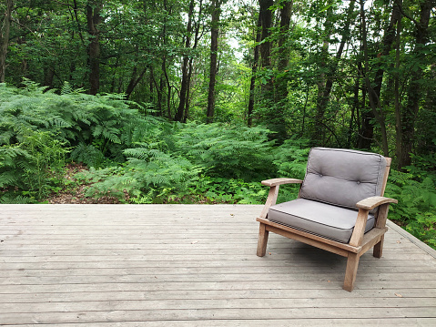 Old wooden chair for outdoor furniture in tropical garden