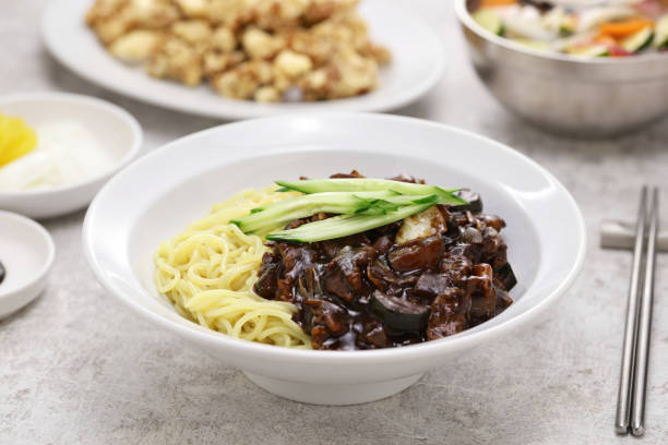 Jajangmyeon and Tangsuyuk are a popular Korean Chinese dish known as Korean black bean noodles and Korean sweet and sour pork (separate dish version). Tangsuyuk, Korean style sweet and sour pork separate dish version.
Jajangmyeon, Korean style zhajiangmian, noodles served with fried black bean sauce. auriculariales photos stock pictures, royalty-free photos & images