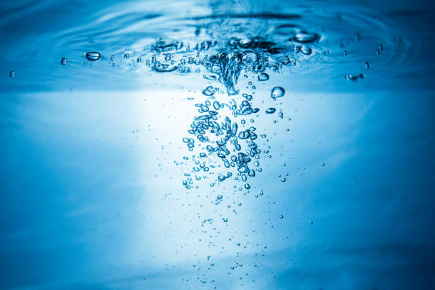 istock An abstract background created by air bubbles in water under blue lighting. 1430230294