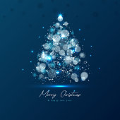 istock Magic Xmas tree made from blue lights on dark background 1430233883