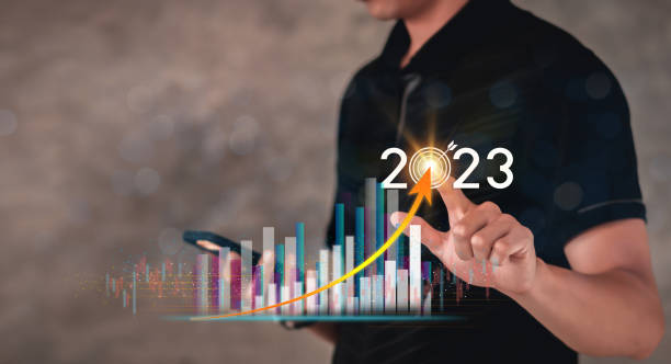 istock Businessman touch the glow light Data digital marketing graph and chart with arrow up.positive indicators in 2023, businessman calculates financial data for long-term investments. 1430234103