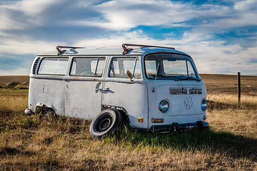 Swift Current, SK/Canada- Sept 11, 2022: Side view of an abandoned VW van on the Saskatchewan prairies