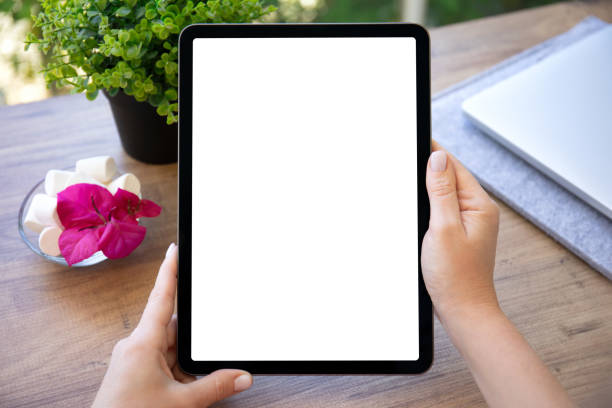 istock female hands hold computer tablet with isolated screen in cafe 1430236115