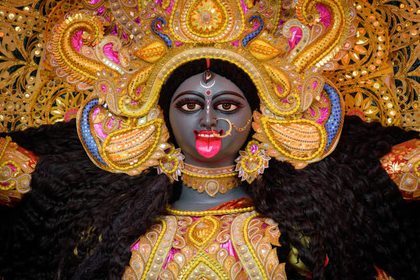 Idol of Goddess Maa Kali at a decorated puja pandal in Kolkata, India Idol of Goddess Maa Kali at a decorated puja pandal in Kolkata, West Bengal, India. Kali puja also known as Shyama Puja is a famous religious festival of Hinduism. kali statue stock pictures, royalty-free photos & images