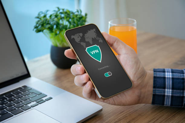 istock male hand holding phone with app vpn on the screen 1430240250