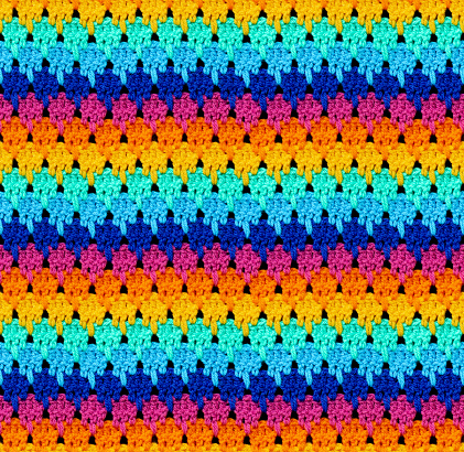 Seamless knitted texture. The pattern is crocheted from bright contrasting colors of acrylic yarn. Ethnic color motifs.