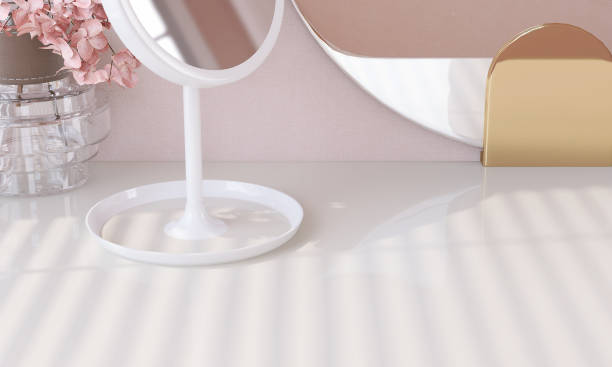 istock Close up and high angle view of white modern and luxury standing vanity mirror on white dressing table in sunlight from window blinds 1430246492