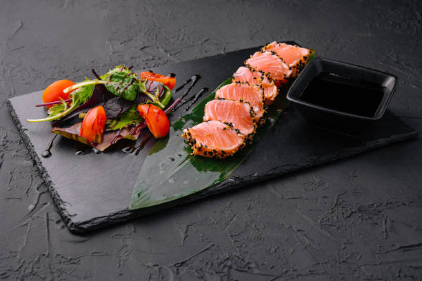 istock Salmon tataki in sesame with salad 1430250618
