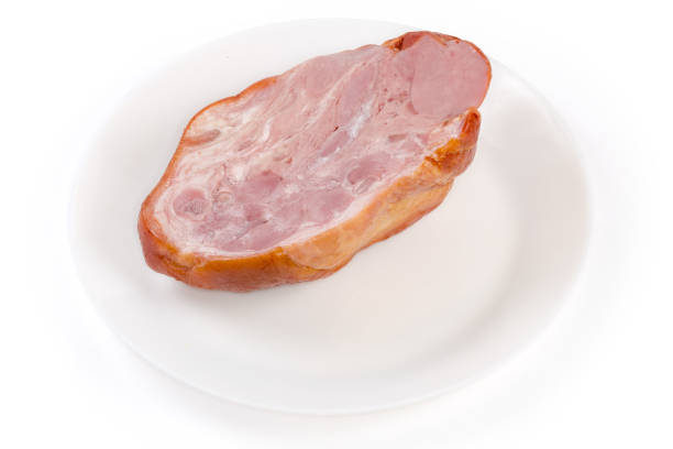 Sliced Canadian Bacon on white background from above