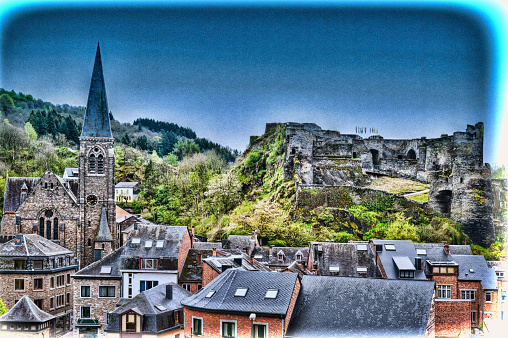 View of the Church and the Castle in the Belgian City of La Roche. View of the town centre below its medieval Castle in of La Roche. Vintage Style Toned Picture