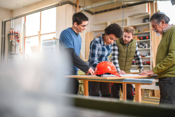 istock Carpenters In A Workshop Having Fun Working On The Details 1430255984