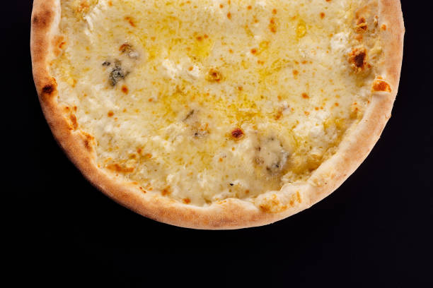istock Pizza four cheeses on a black background 1430261346