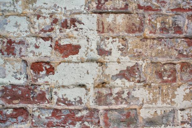 istock Red brick wall texture bright plaster stucco cement wall loft background. Gray grunge concrete urban old peeling rusty stone blocks concept 1430262251