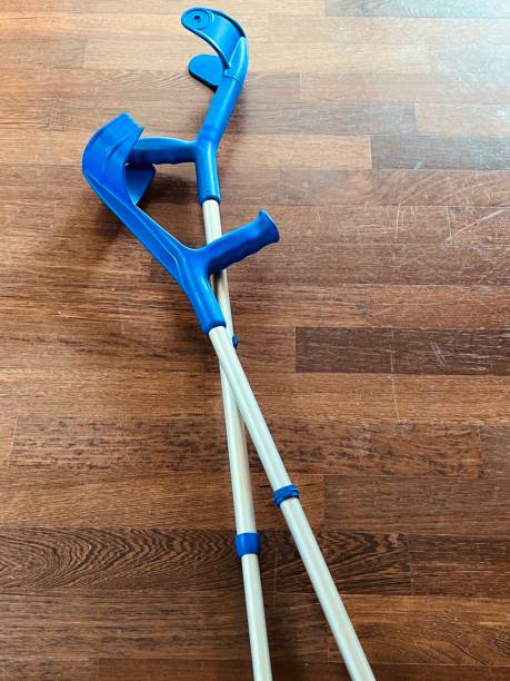 istock Crutches on parquet background 1430263091