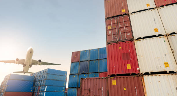 istock Air logistics. Cargo airplane flying above stack of logistic container. Cargo and shipping business. Container ship for export logistic. Logistic industry from port to port. Freight transportation. 1430264555
