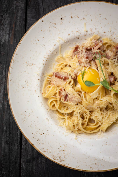 istock delicious pasta with cheese, greens, egg, sauce 1430264996