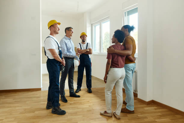 istock Manual workers and architect talking to customers in the apartment. 1430266590