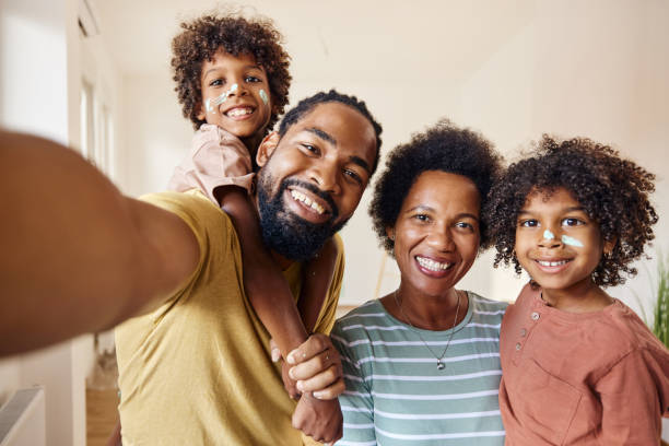 istock Happy black family taking a selfie during home renovation process. 1430266744