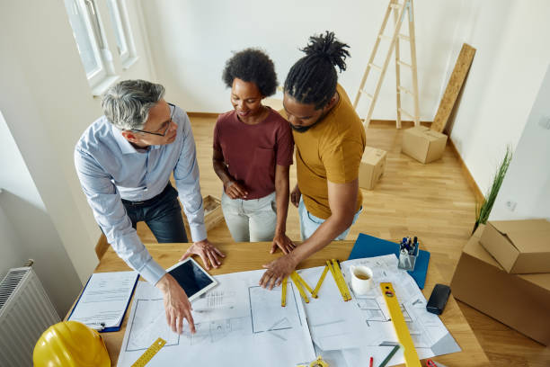 istock Above view of talking about housing plan with an architect. 1430267350