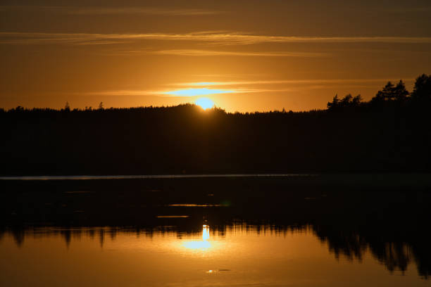 istock Sunset with reflection on a Swedish lake in Smalland. Romantic evening mood 1430267535