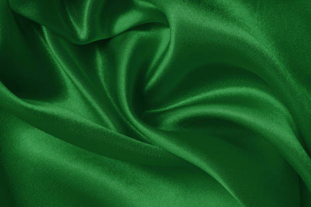 istock Dark green fabric cloth texture for background and design art work, beautiful crumpled pattern of silk or linen. 1430278437