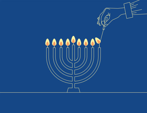 ilustrações de stock, clip art, desenhos animados e ícones de hand lighting candle on metal hanukkah menorah on surface against blue background. man lighting up candles in menorah. jewish woman celebrating holidays hanukkah - menorah