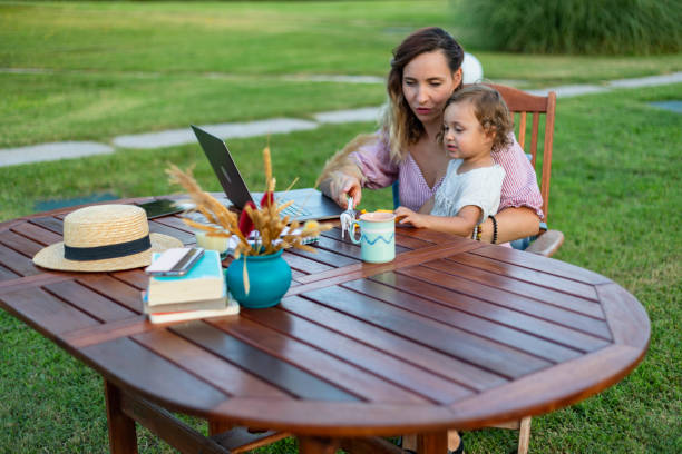 istock The woman is working and playing with her child at the same time. 1430280575
