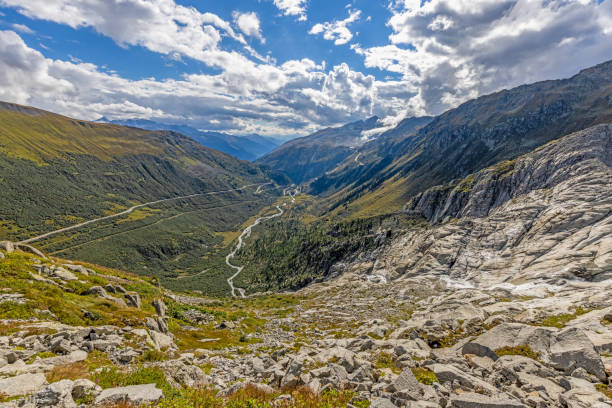 View of the Grimsel Pass from the Furka Pass in Switzerland View of the Grimsel Pass from the Furka Pass in Switzerland during the day in summer grimsel pass photos stock pictures, royalty-free photos & images