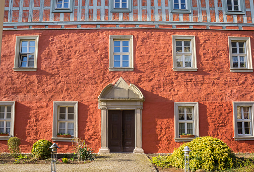 Red facade of a historic house in Aschersleben, Germany