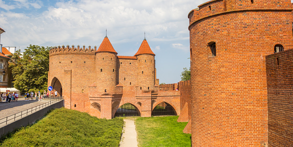Historic red brick city gate in the center of Warsaw, Poland