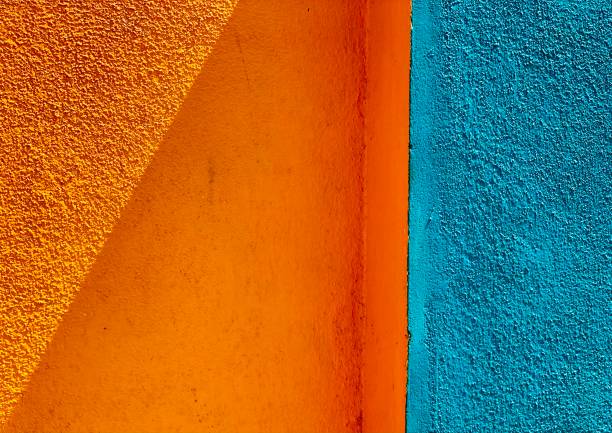 Orange and blue background. Shape and line concept in wall.