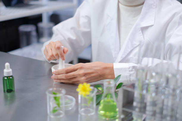 istock Professional scientist use a laboratory Porcelain Mortar to mashed ingredients for Natural skin care beauty products, Alternative herb or botany medicine,Concept of experiment, discovery and analysis 1430287017