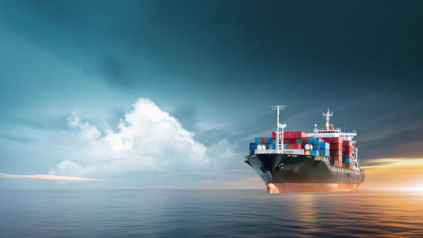 istock Container cargo ship in ocean at sunset dramatic sky background with copy space, Nautical vessel and sea freight shipping, International global business logistics transportation import export concept 1430288254