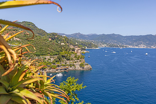 View of the famous Italian coastal town of Portofino taken from the castle during the day in summer