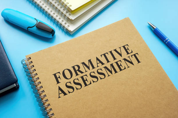 istock Formative Assessment guide and notebooks on the desk. 1430290328
