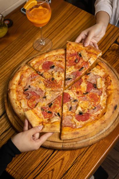istock delicious pizza with cheese, greens, sauce 1430291060