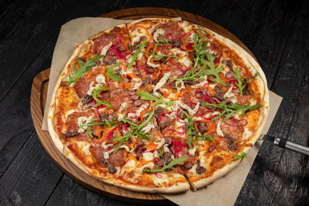 istock delicious pizza with cheese, greens, sauce 1430292241