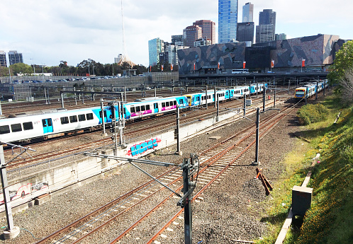 Melbourne, Victoria, Australia, October 11, 2016; Metro train are near Flinders Street Railway Station in the afternoon; Many high buildings of Southbank in the city of Melbourne