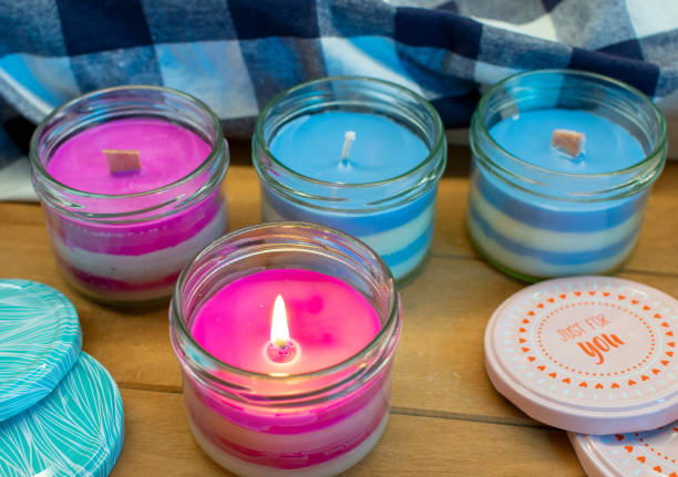 istock Burning candle with stripes in a screw-top jar. 1430293308