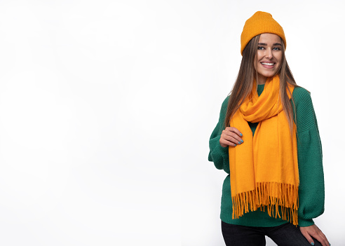 Young woman in a cap and a scarf - perfect autumn stylization.