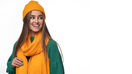 Young woman in a cap and a scarf - perfect autumn stylization.