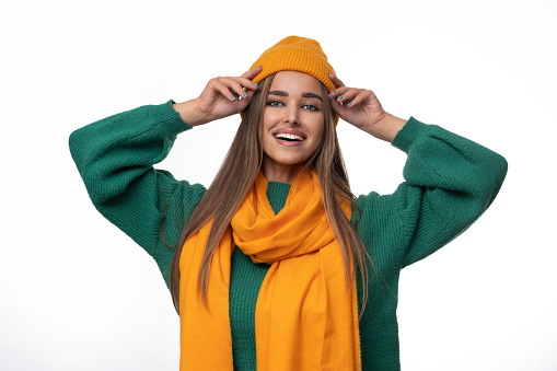 Young woman in a cap and a scarf - perfect autumn stylization.